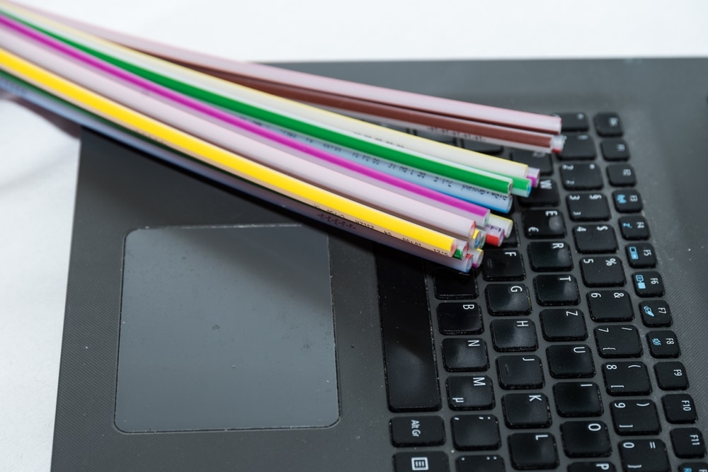 Fiber,Optic,Cable,And,Laptop,For,Fast,Internet, ,Data