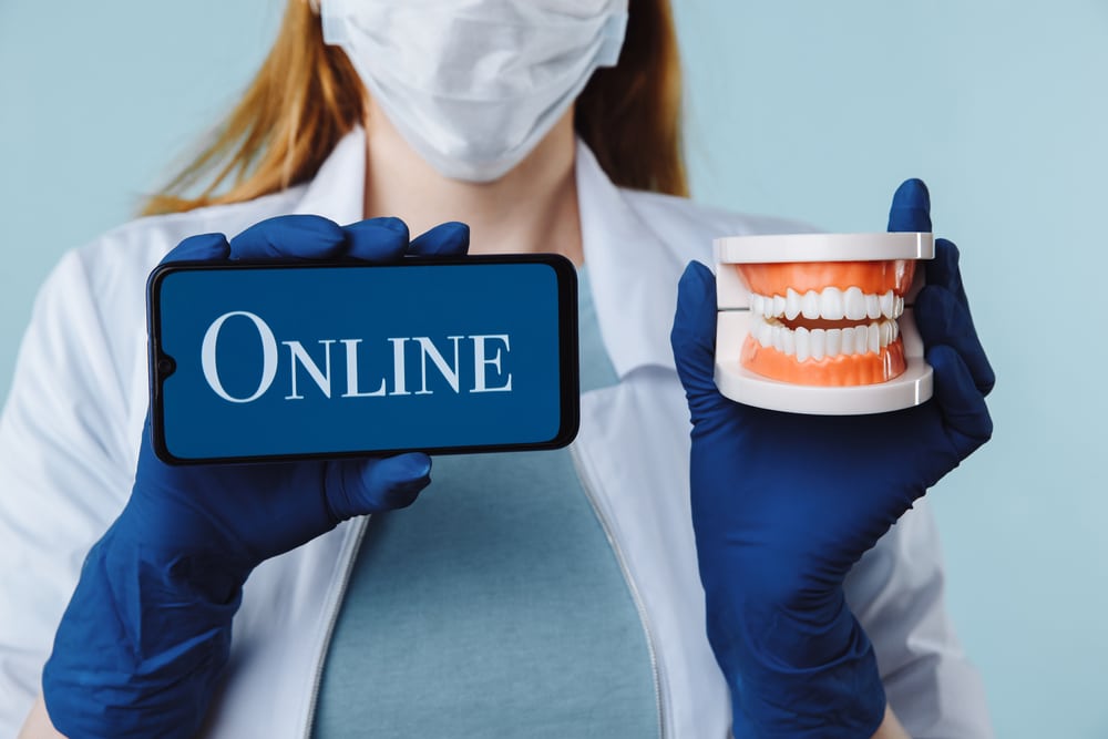 Portrait,Of,Beautiful,Female,Dentist,Posing,In,Dental,Clinic,Holding