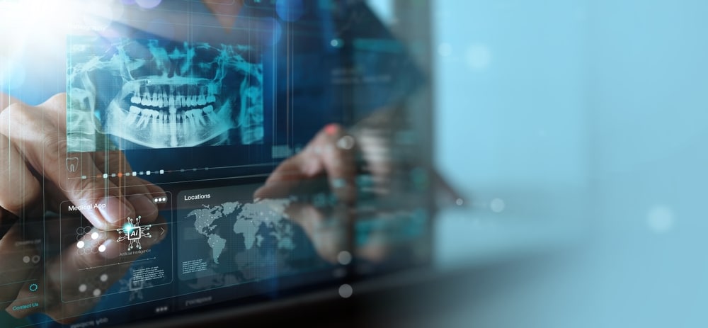 Dentist,Looking,On,The,Virtual,Ai,X ray,Of,A,Jaw